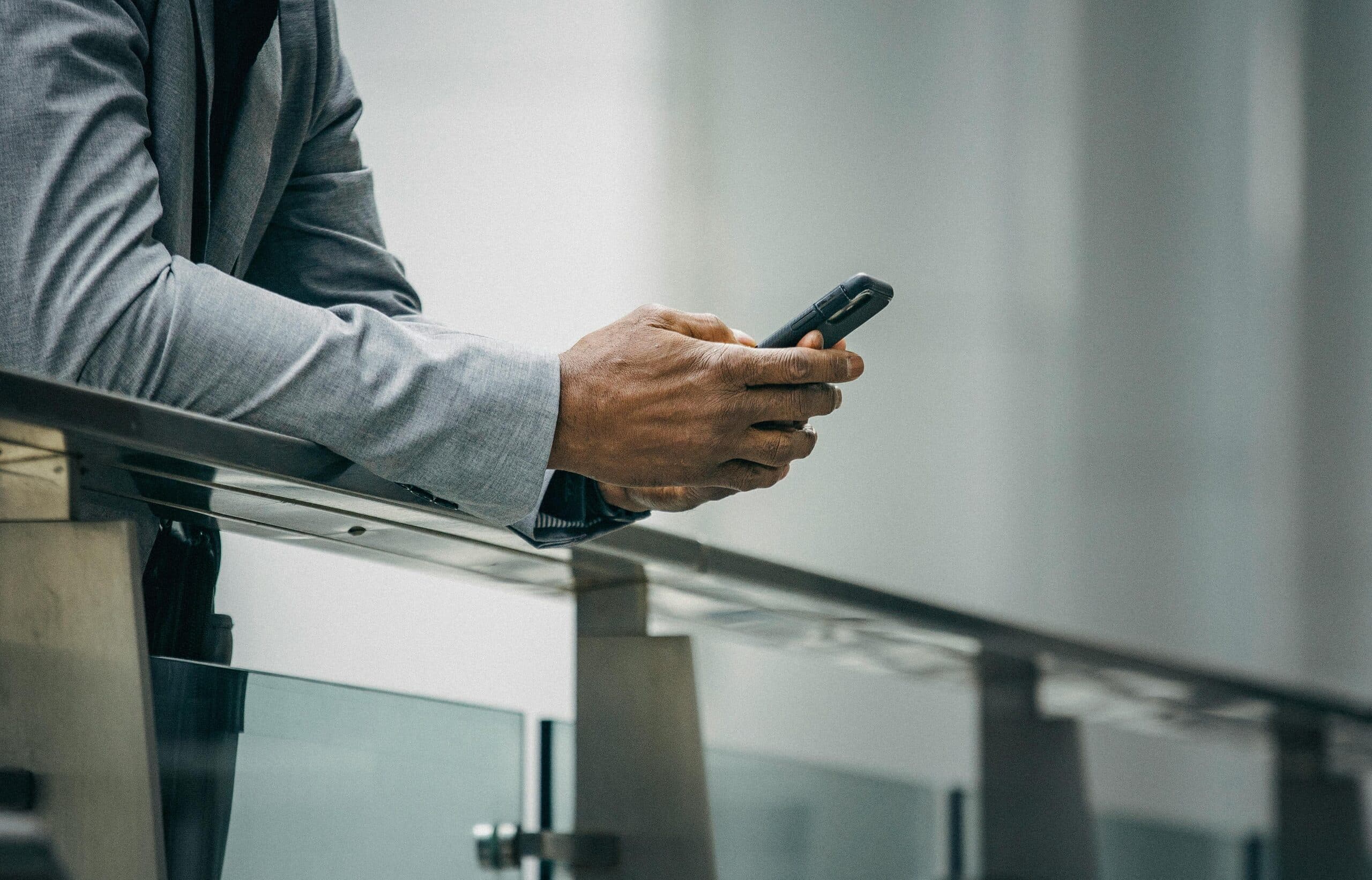Person using a payment terminal at a counter in a retail setting